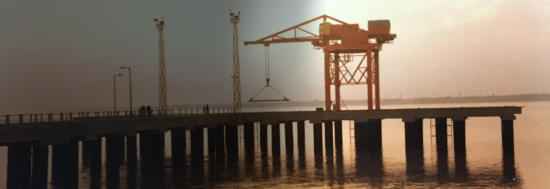 Berthing Jetty With Container Handling Crane on River Ganges